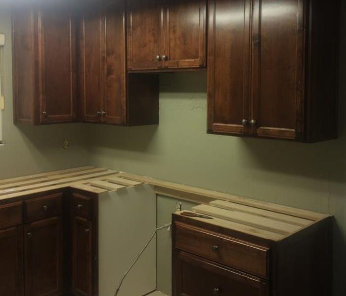 a kitchen with missing countertops