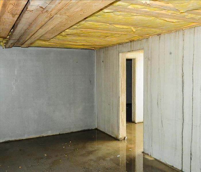 a removed ceiling with water dripping from the walls
