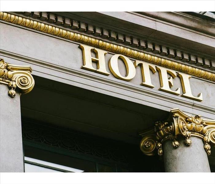 Hotel word with golden letters on luxury hotel with beautiful columns