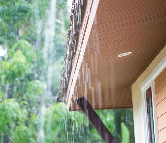 Rain flowing off a roof.